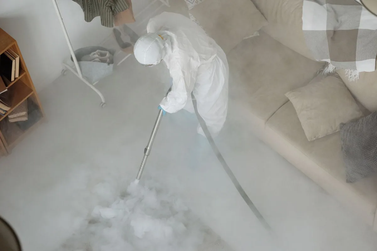 Biohazard cleanup technician in protective equipment, Farmington, MI